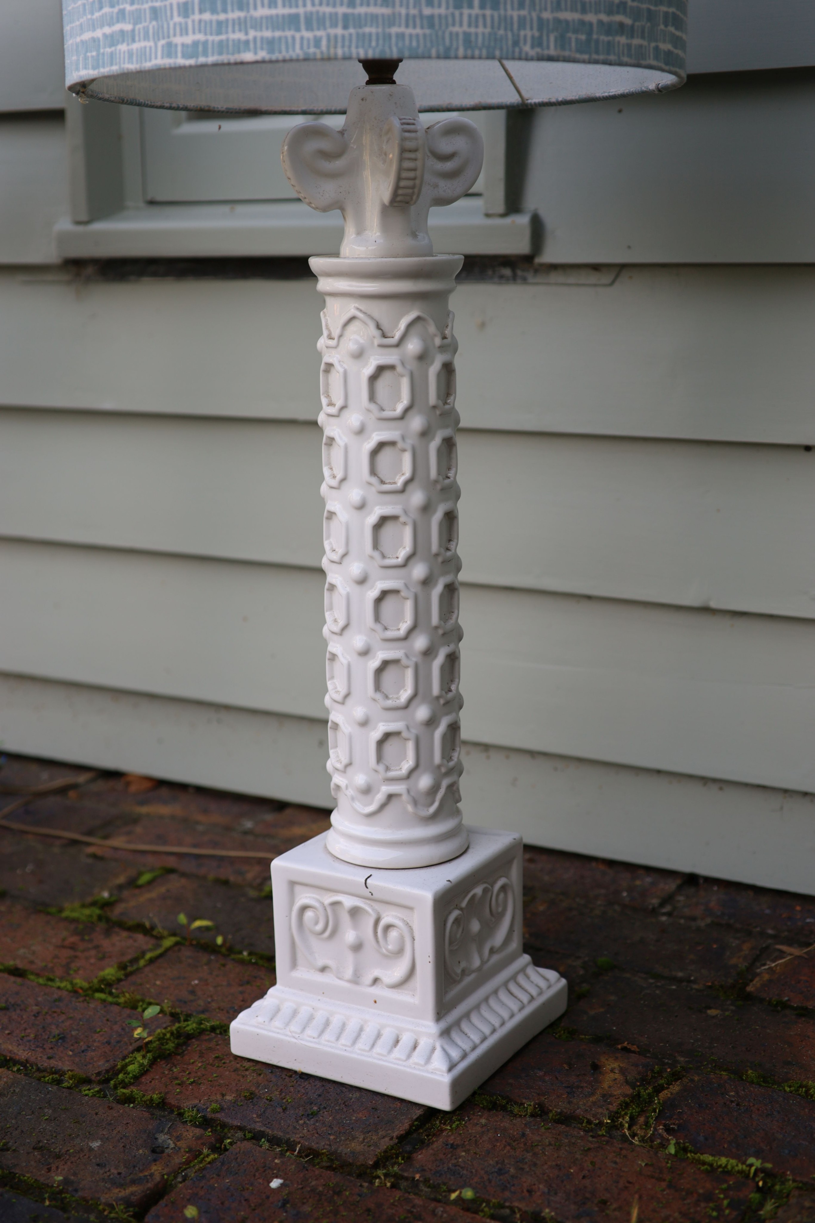 A pair of white glazed pottery table lamps, height to fittings 67cm (one a.f.)